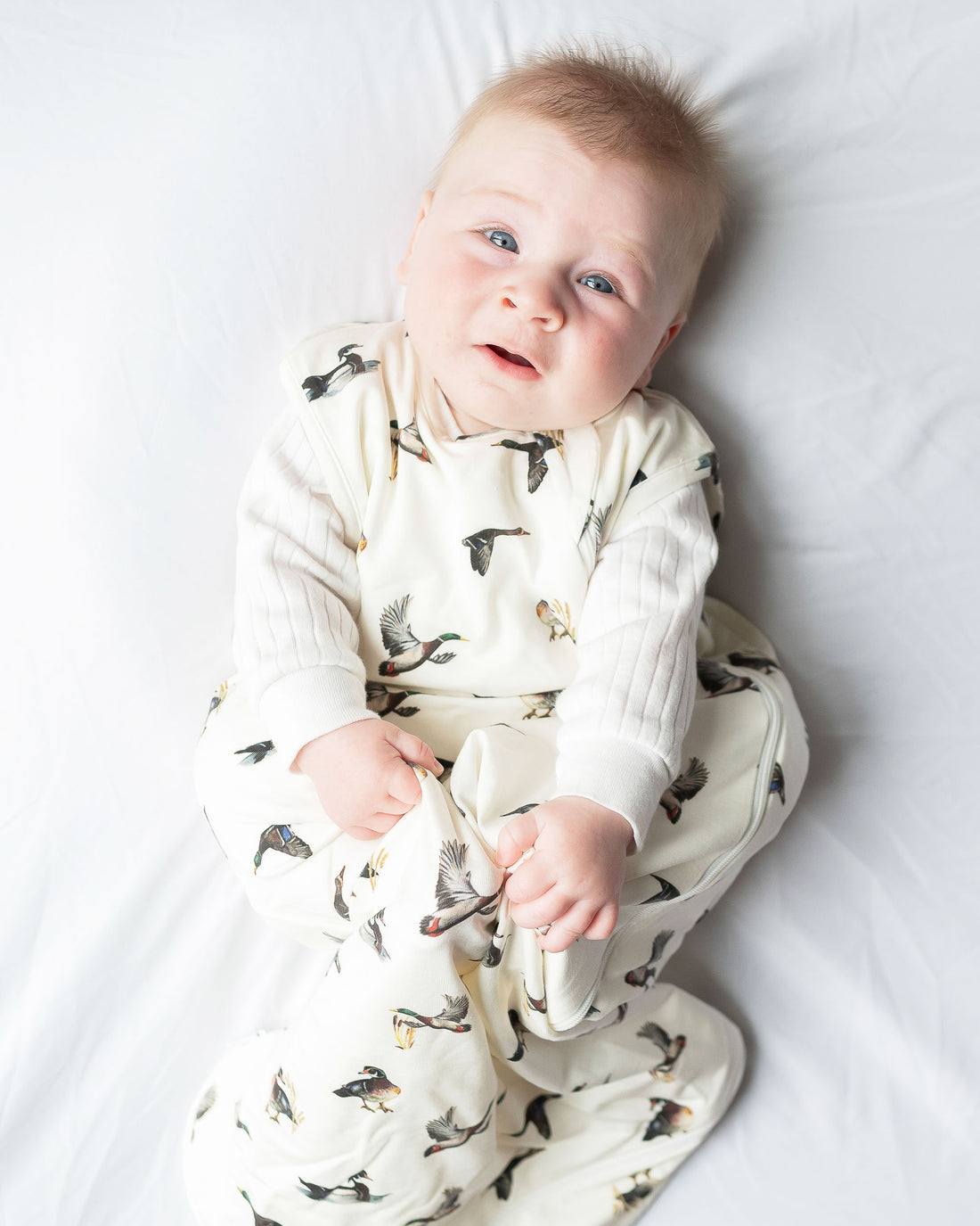 Baby sleep sack featuring a charming diving ducks print, perfect for cozy nighttime snuggles