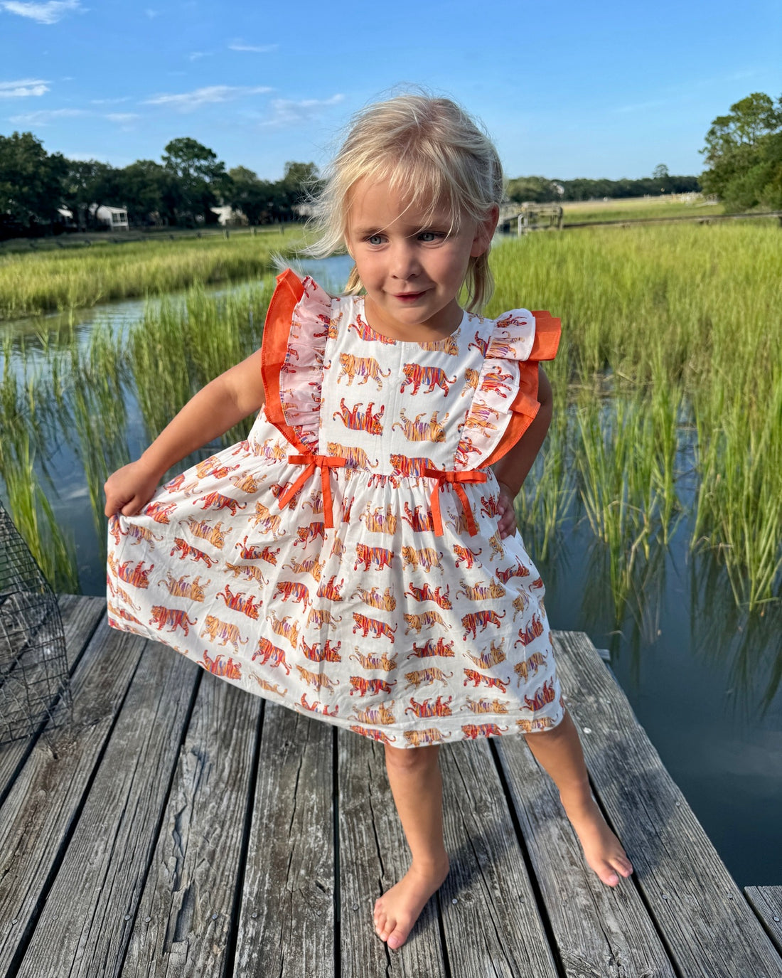 Easy Tiger Flutter Sleeve Dress captured in a playful outdoor setting, ideal for active kids and casual adventures.