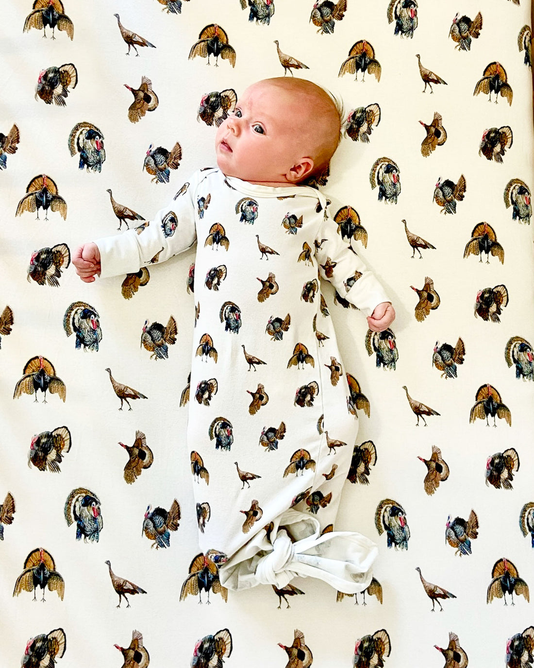 Turkey Trot crib sheet featuring adorable turkey print on soft jersey cotton for nursery decor.